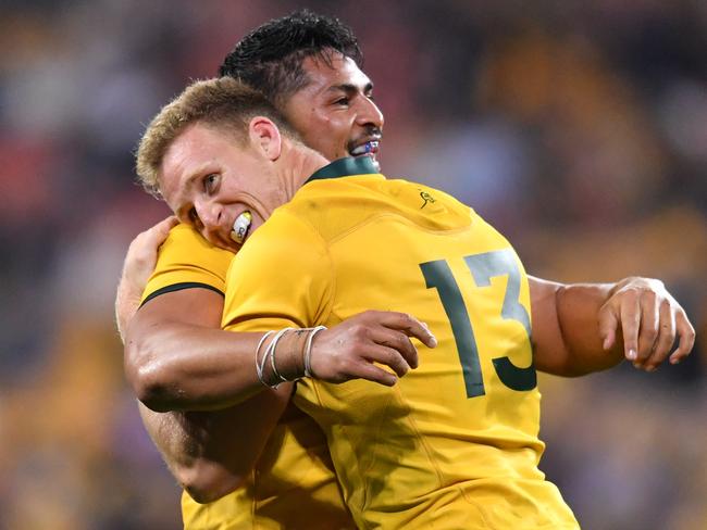 Pete Samu and Reece Hodge embrace after downing South Africa. Picture: AAP