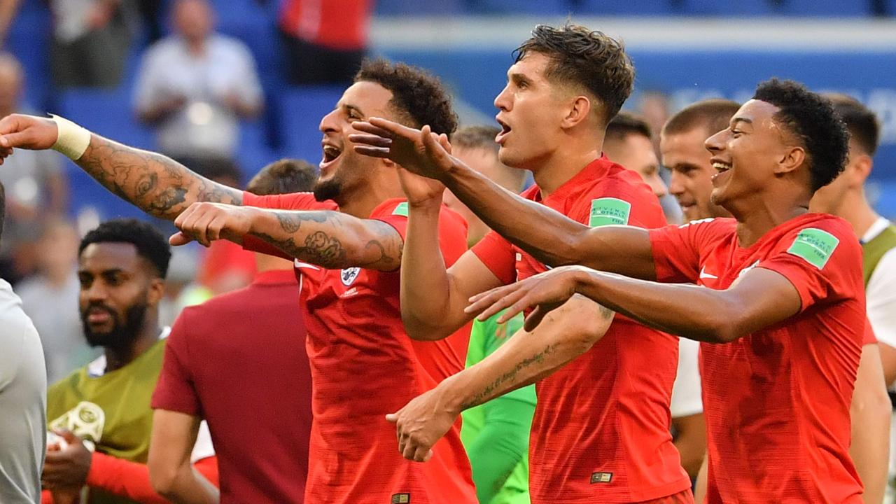 England player Kyle Walker (L), John Stones (C) and Jesse Lingard celebrate their victory against Sweden.