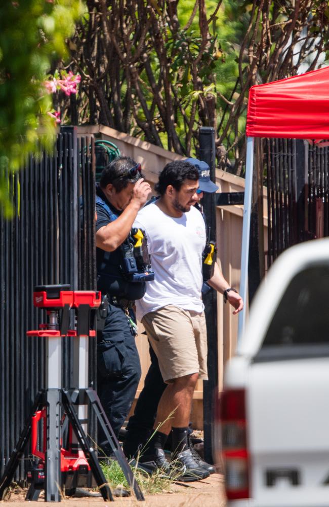 Jonathan Wesley is arrested outside his mother Dianne Hewitt's home in Nightcliff on Tuesday. Picture: Pema Tamang Pakhrin