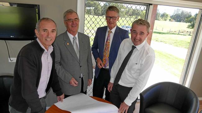 UNIT TRUST: Member for Clarence Chris Gulaptis, Clarence Village chairman Geoff Shepherd, architect Dayne Mearns and the Member for Page Kevin Hogan go over the plans for the 20 new units. Picture: Tim Howard