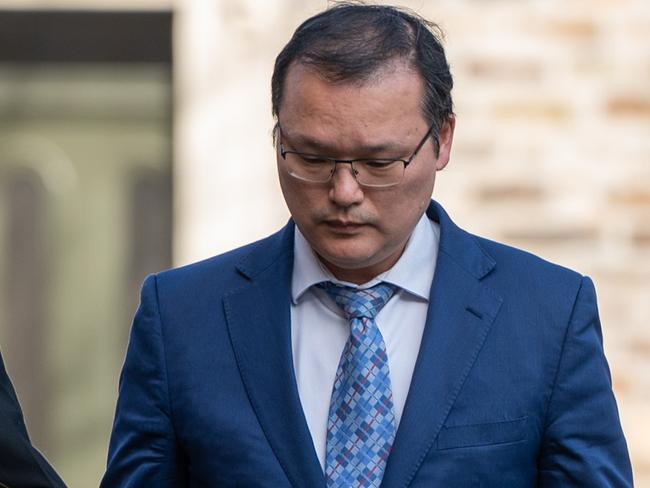 ADELAIDE, AUSTRALIA - NewsWire Photos August 29, 2023: Ho Keun Shin (right), a breast surgeon who indecently filmed patients using a mobile phone secreted inside a tissue box with the corner cut off. He is pictured with his legal team at Magistrates Court. Picture: NCA NewsWire / Naomi Jellicoe