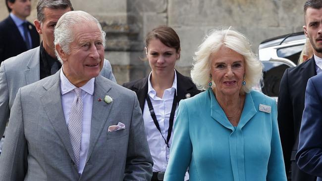 Britain's Queen Camilla (R) and King Charles III (L) arrive at The Bordeaux's Hotel de Ville (city hall) in Bordeaux, southwestern France, on September 22, 2023. Britain's King Charles III and his wife Queen Camilla are on a three-day state visit starting on September 20, 2023, to Paris and Bordeaux, six months after rioting and strikes forced the last-minute postponement of his first state visit as king. (Photo by Thibaud MORITZ / POOL / AFP)