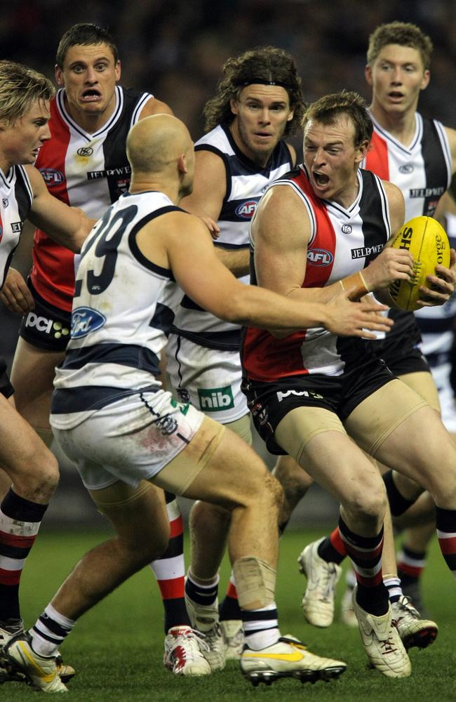 Brendon Goddard braces for impact from Gary Ablett Jr.