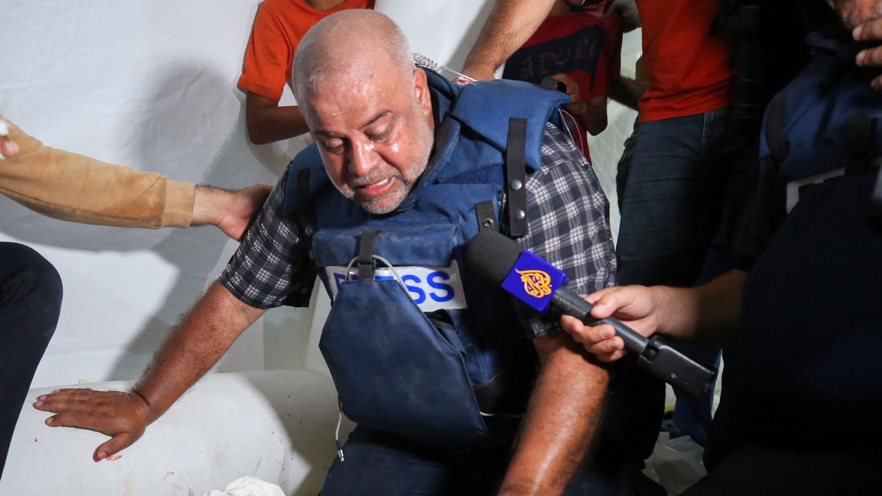 Wael Al-Dahdouh mourns over the body of one of his children. Picture: Majdi Fathi/AFP