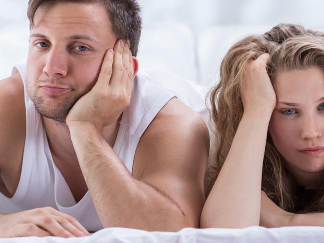 Couple lying in bed is not talking after argument