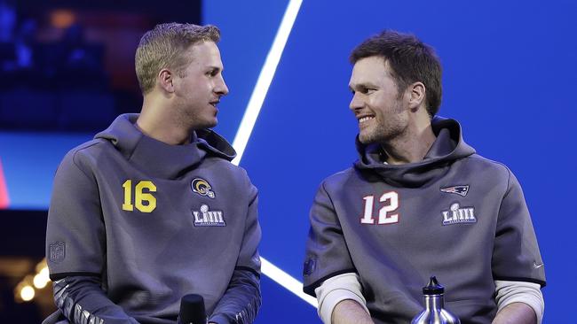 Los Angeles Rams' Jared Goff talks to New England Patriots' Tom Brady ahead of the NFL Super Bowl 53 in Atlanta. Picture: AP Photo/Matt Rourke