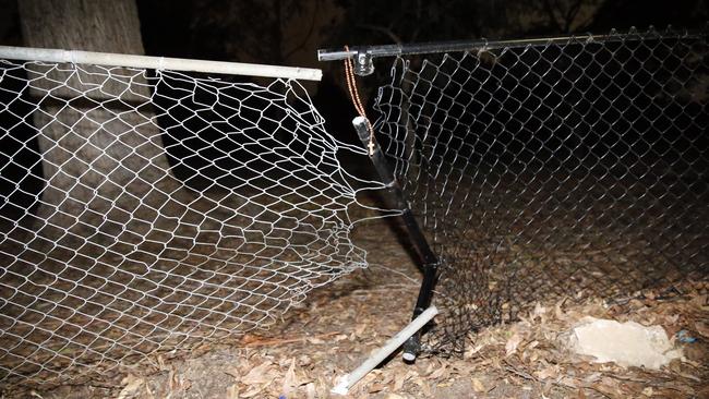 A cross hung on the fence by family and friends at the spot of a fatal accident on Bettington Rd, Oatlands on Saturday night. Picture: Steve Tyson