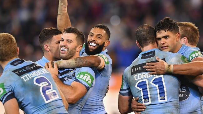 Blues players celebrate winning game one of this year’s Origin series.