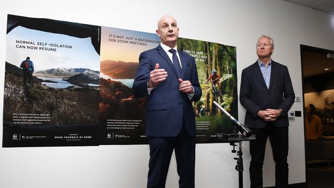 Premier Peter Gutwein with the Make Yourself at Home posters. Picture: ZAK SIMMONDS