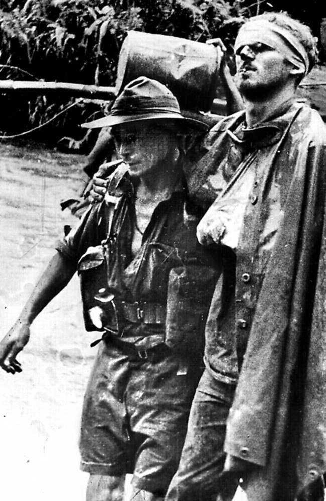 The famous image of wounded Digger William “Wally” Johnson being led by medic GRC Ayer on the Kokoda Track, New Guinea, during World War II.