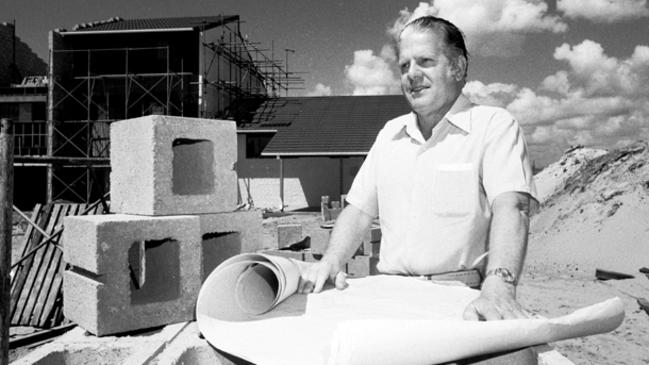 Alderman John Robert (Jock) McIlwain, with plans at a construction site, Gold Coast, Queensland, circa 1970s Picture: A.L. Lambert. Photo supplied by the Gold Coast Local Studies Library.