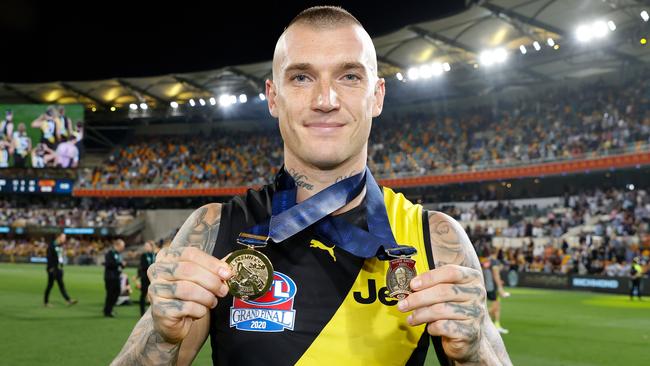 BRISBANE, AUSTRALIA - OCTOBER 24: Dustin Martin of the Tigers celebrates with his Norm Smith Medal and Premiership Medal during the 2020 Toyota AFL Grand Final match between the Richmond Tigers and the Geelong Cats at The Gabba on October 24, 2020 in Brisbane, Australia. (Photo by Michael Willson/AFL Photos via Getty Images)