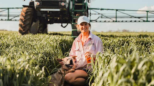 Heidi Morris and cattle dog Laurie relax after a hard day’s work on a farm at Moree.