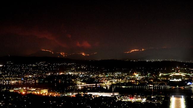 The Orroral Valley fire burns behind Canberra last night. Picture: Getty Images