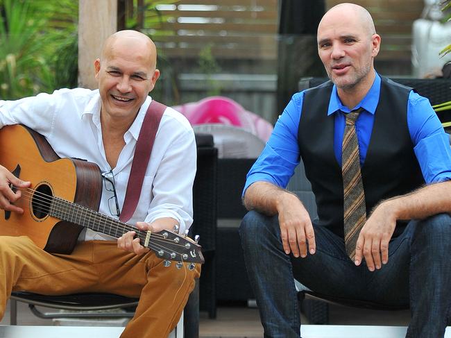 Pictured is lead singer of legendary group Boom Crash Opera, Dale Ryder at his home in Lynbrook with fellow band member Ian Tilley. Picture: Derrick den Hollander