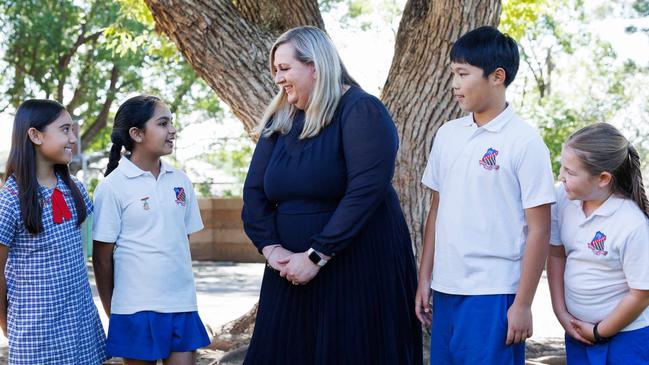 Revesby Public School principal Narelle Nies with students Shabnum Hassan, Seerat Allah, Oliver Yao and Ruby Howard. Picture: David Swift