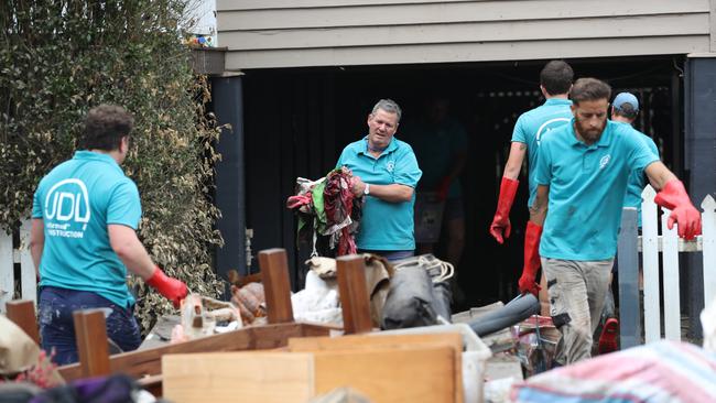 Cleaning up in Vincent St, Auchenflower. Picture: Annette Dew