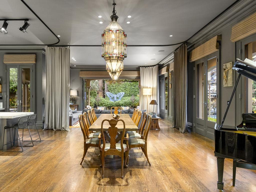 A dining room with space for a piano.