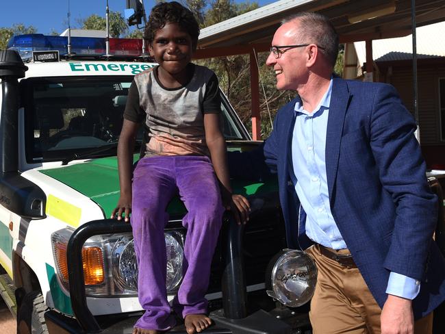 Jay Weatherill with young Monica Roberts with an ambulance in Umuwa. Picture: Naomi Jellicoe