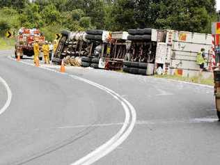 The Casino driver of this semi-trailer escaped injury yesterday when it rolled on to its side on the Lismore-Bangalow Road near Binna Burra. The accident happened just after midday and traffic was disrupted for several hours. . Picture: Jay Cronan