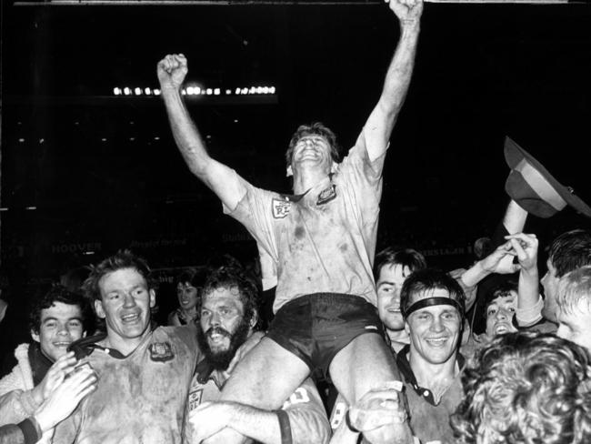 Blues captain Steve Mortimer is chaired off the ground by teammates Peter Wynn, Noel Cleal and Wayne Pearce following victory in 1985. Picture: Graeme Fletcher