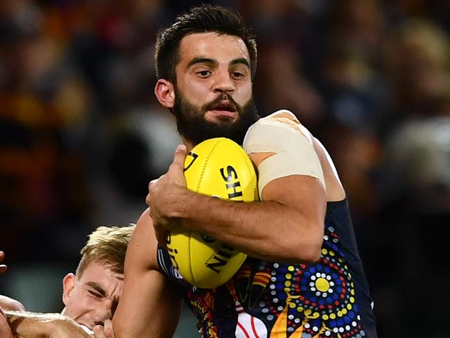 ADELAIDE, AUSTRALIA - JULY 06: Wayne Milera of the Adelaide Crows caught by Dougal Howard of Port Adelaide during the round 16 AFL match between the Adelaide Crows and the Port Adelaide Power at Adelaide Oval on July 06, 2019 in Adelaide, Australia. (Photo by Mark Brake/Getty Images)