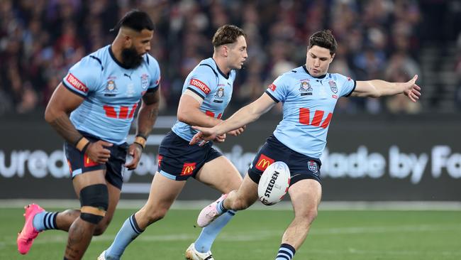 Mitchell Moses gets a kick away early in Game 2. (Photo by Cameron Spencer/Getty Images)