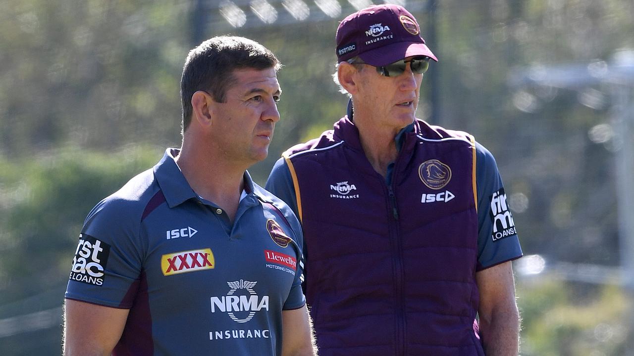 Jason Demetriou (left) has given Anthony Seibold a serve.