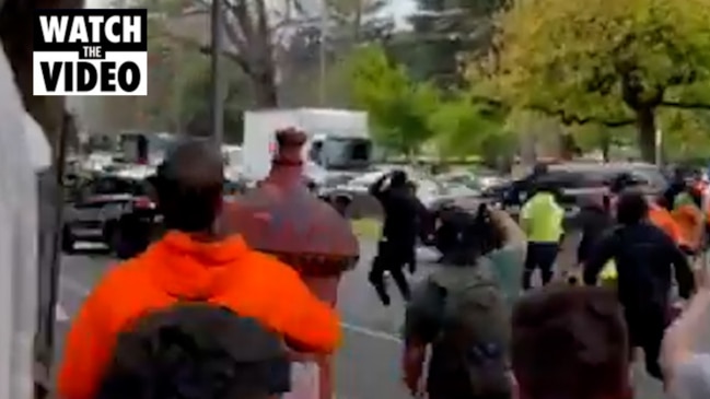 Protesters and construction workers march through the streets of Melbourne