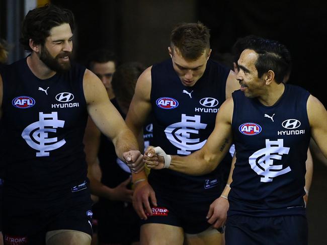 Levi Casboult (L) and Eddie Betts (R) ran out for their final games in navy blue on Saturday. (Photo by Quinn Rooney/Getty Images)