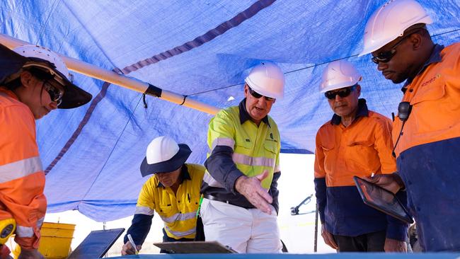 Hawsons Iron executive chairman, Bryan Granzien inspects samples being collected as part of the site resource investigations at the Hawsons Iron Project near Broken Hill in New South Wales.