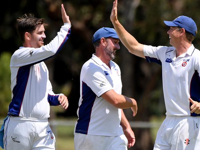 BanyuleÃs Nick Murray, left celebrates a wicket during the DVCA Cricket: Banyule v Epping match in Heidelberg, Saturday, Jan. 30, 2021. Picture: Andy Brownbill