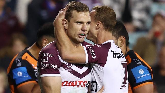 SYDNEY, AUSTRALIA - AUGUST 22: Tom Trbojevic of the Sea Eagles celebrates scoring a try with DalyÃÂ Cherry-Evans of the Sea Eagles during the round 25 NRL match between Wests Tigers and Manly Sea Eagles at Leichhardt Oval on August 22, 2024 in Sydney, Australia. (Photo by Jason McCawley/Getty Images)