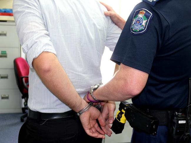 A man being handcuffed by police. Generic queensland police. Photo Amy Lyne / Gatton Star