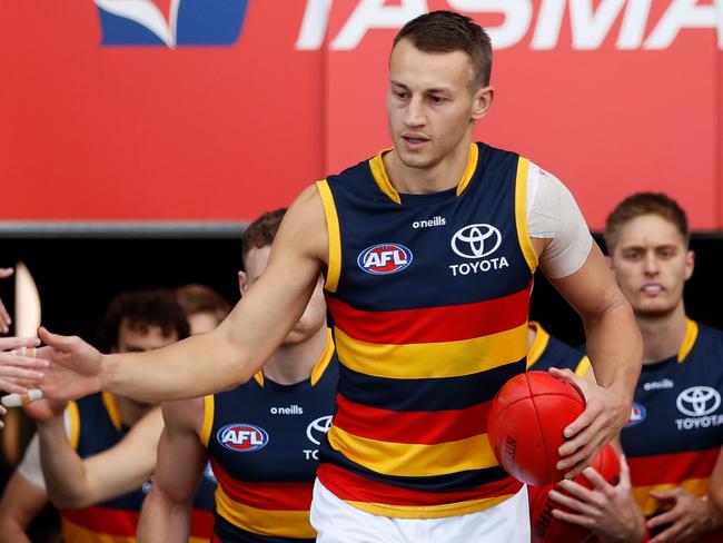 HOBART, AUSTRALIA - JUNE 26: Tom Doedee of the Crows leads his team up the race during the 2022 AFL Round 15 match between the North Melbourne Kangaroos and the Adelaide Crows at Blundstone Arena on June 26, 2022 in Hobart, Australia. (Photo by Dylan Burns/AFL Photos via Getty Images)