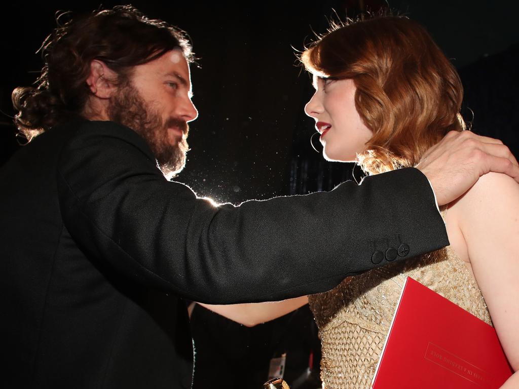 Emma Stone holding “Best Actress” envelope greets Casey Affleck backstage during the 89th Annual Academy Awards. Picture: AFP