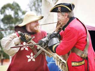 Norm Kaden (left) and Sir Antony Dealbern of the Caribbean Trading Co in Ipswich battle it out at the Fernvale Environmental and Heritage Festival. . Picture: David Nielsen