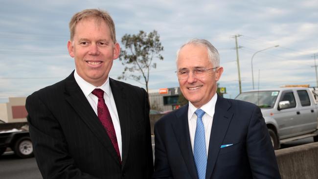 Australian Prime Minister Malcolm Turnbull poses with Liberal Member for Forde Bert Van Manen beside the M1 Highway at Yatala on June 22.