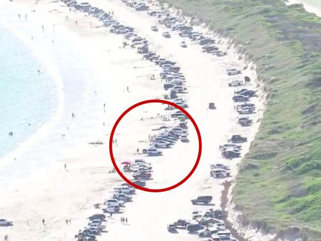 A screenshot from Channel 9 coverage shows cars lining Boat Harbour.