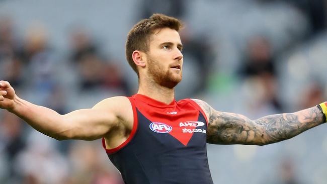 MELBOURNE, AUSTRALIA - AUGUST 01: Jeremy Howe of the Demons celebrates after kicking a goal during the round 18 AFL match between the Collingwood Magpies and the Melbourne Demons at Melbourne Cricket Ground on August 1, 2015 in Melbourne, Australia. (Photo by Quinn Rooney/Getty Images)