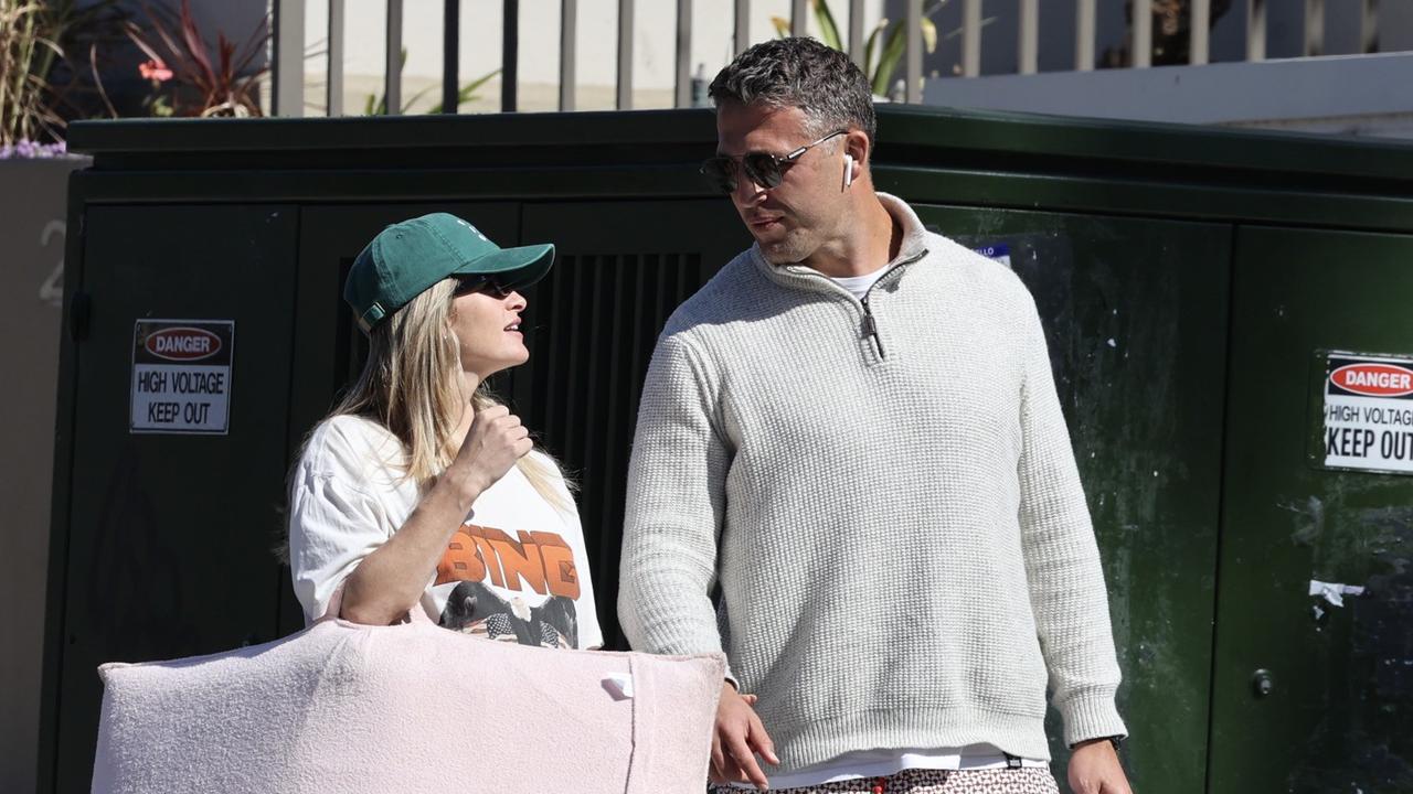 Sam Burgess chills out at the beach after his sensational walkout on his role as Rabbitohs assistant coach earlier this week. Pictured with pregnant fiancee Lucy Graham. Picture: Media Mode.