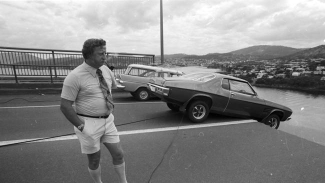 Murray Ling watching the progress as his and Frank Manley’s cars are pulled to safety.