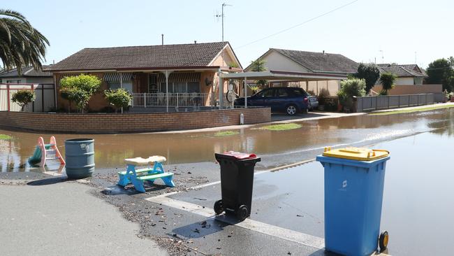 Locals make their own roadblock to stop traffic driving down Ashton Rd in Shepparton. Picture: David Crosling