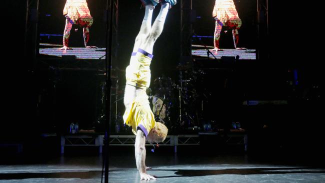 Red Hot Chili Peppers bass player Flea does a handstand to entertain the crowd during a technical failure at the band’s Australian tour opening show at Hobart's Derwent Entertainment Centre. Picture: PATRICK GEE