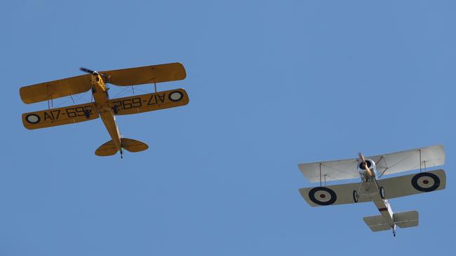 Planes fly overheard at the commemorations. Picture: David Crosling