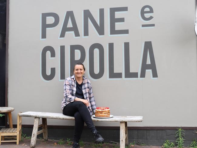 Pane e Cipolla co-owner Vinnie Scalone with one of her housebaked lemon cakes. Picture: Jenifer Jagielski