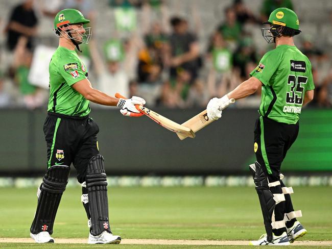 MELBOURNE, AUSTRALIA - JANUARY 16: Marcus Stoinis and Hilton Cartwright of the Stars celebrate the Stars winning the Men's Big Bash League match between the Melbourne Stars and the Brisbane Heat at Melbourne Cricket Ground, on January 16, 2022, in Melbourne, Australia. (Photo by Morgan Hancock/Getty Images)