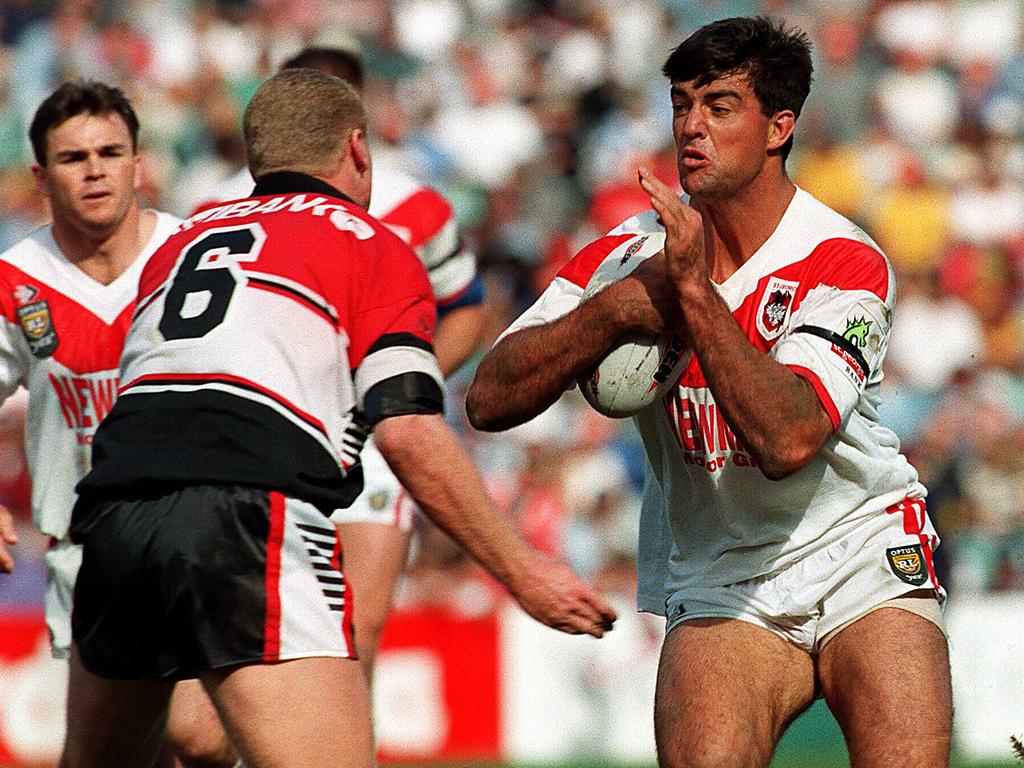 Scott Gourley on charge running at defender Greg Florimo during the 1996 St George v Norths Winfield Cup preliminary final at SFS in Sydney.