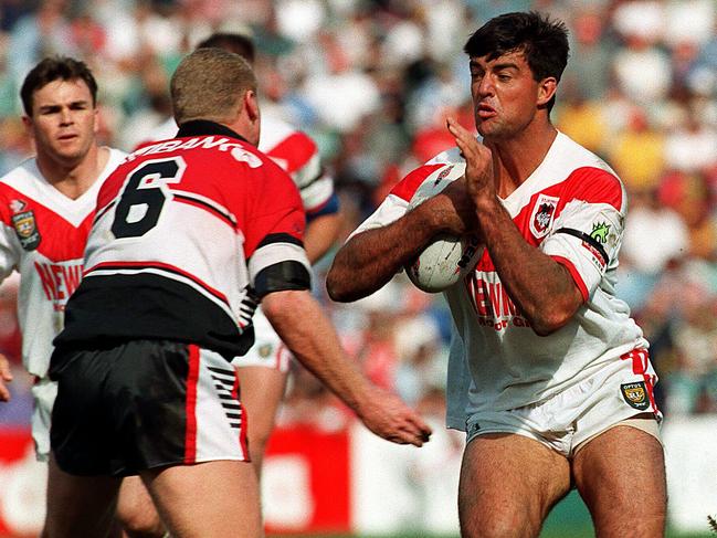 Scott Gourley on charge running at defender Greg Florimo during the 1996 St George v Norths Winfield Cup preliminary final at SFS in Sydney.