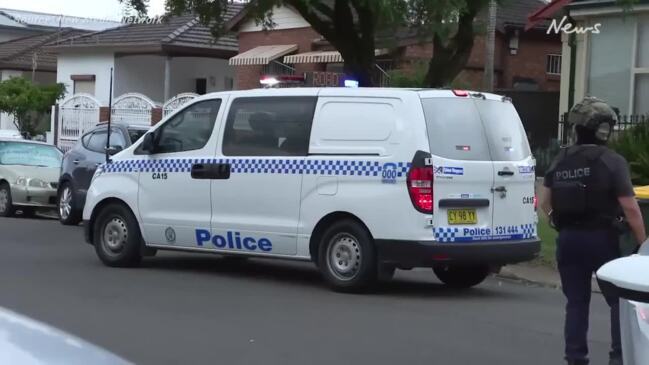 Police storm Belmore home